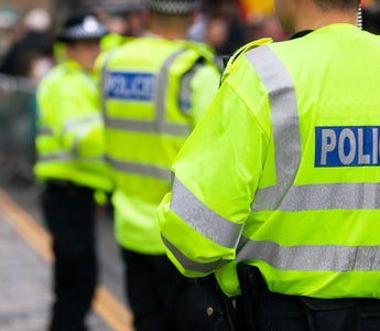 Three police officers standing.