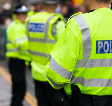 Three police officers standing.