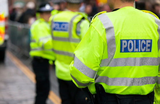 Three police officers standing.